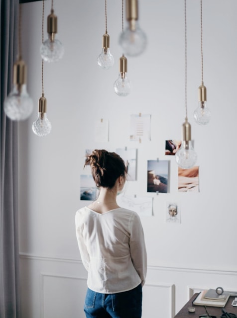 Woman staring at an art-gallery wall