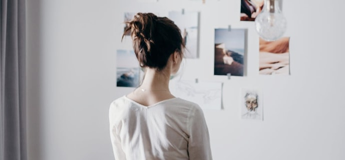 Woman staring at an art-gallery wall